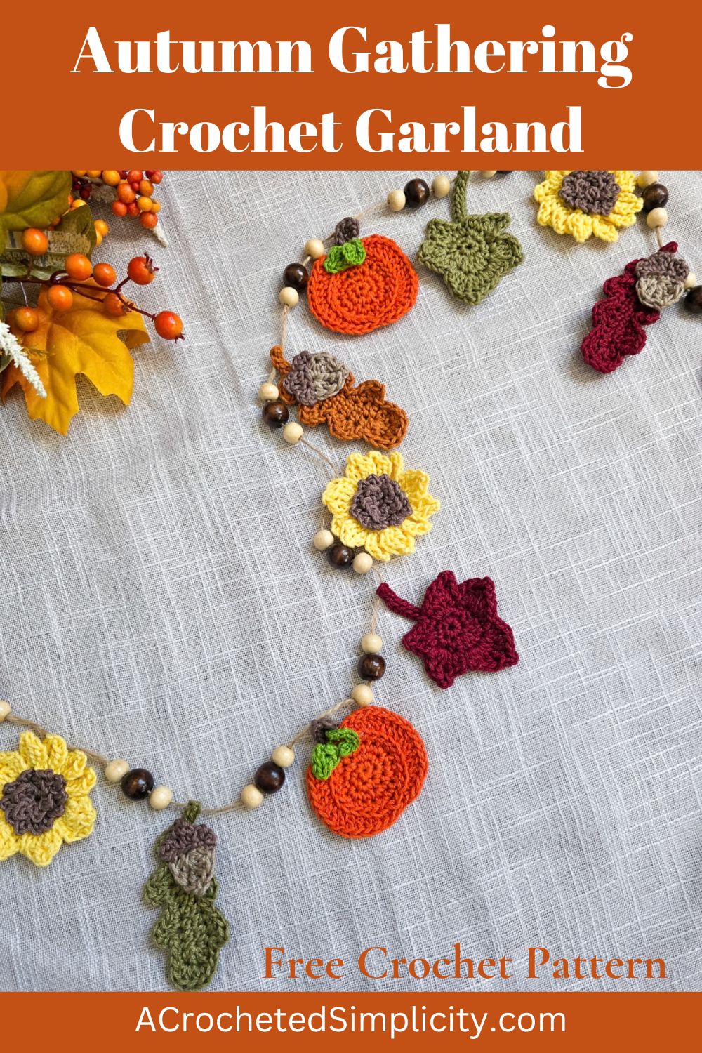 A colorful autumn harvest crochet garland with sunflowers, pumpkins, and leaves.