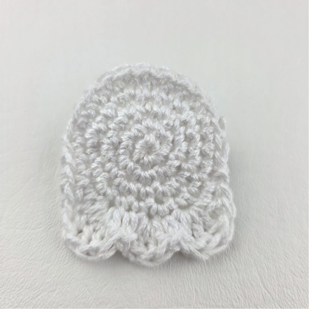 A completed white crochet ghost.