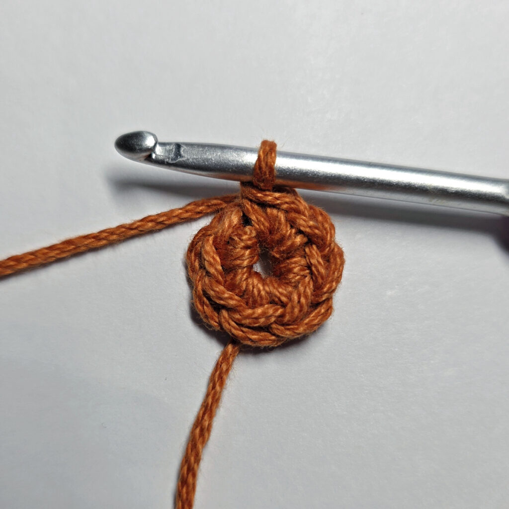Making a crochet maple leaf.