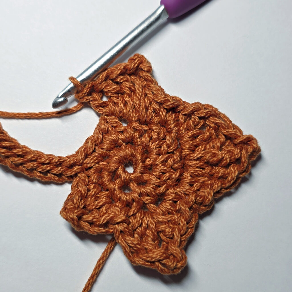 Making a crochet maple leaf.