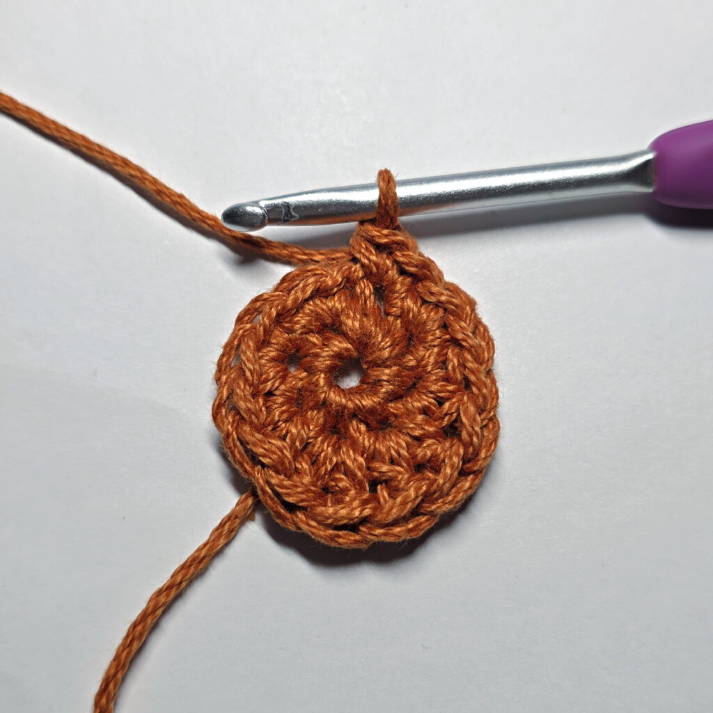 Making a crochet maple leaf.