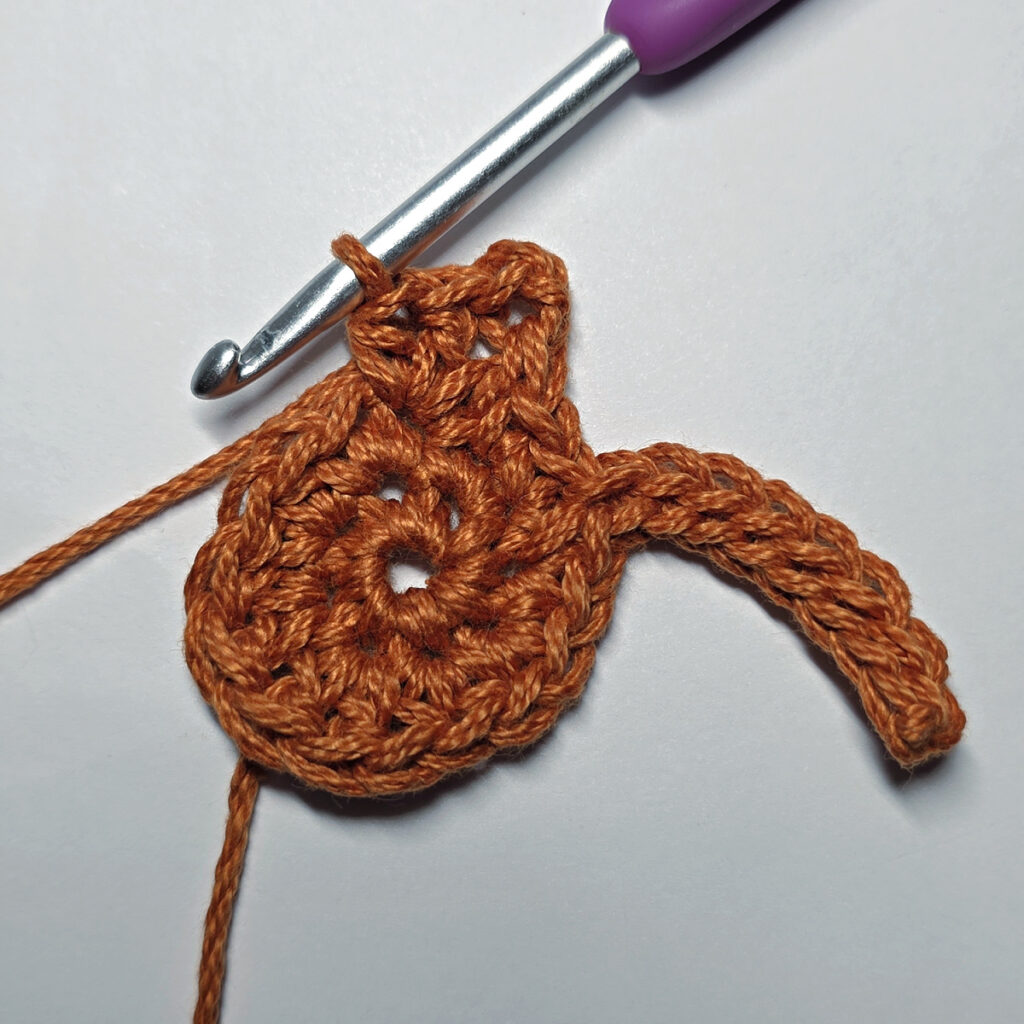 Making a crochet maple leaf.