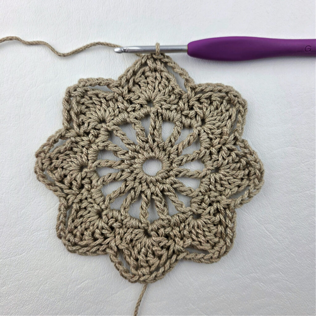 Round 5 of a crochet granny square motif.