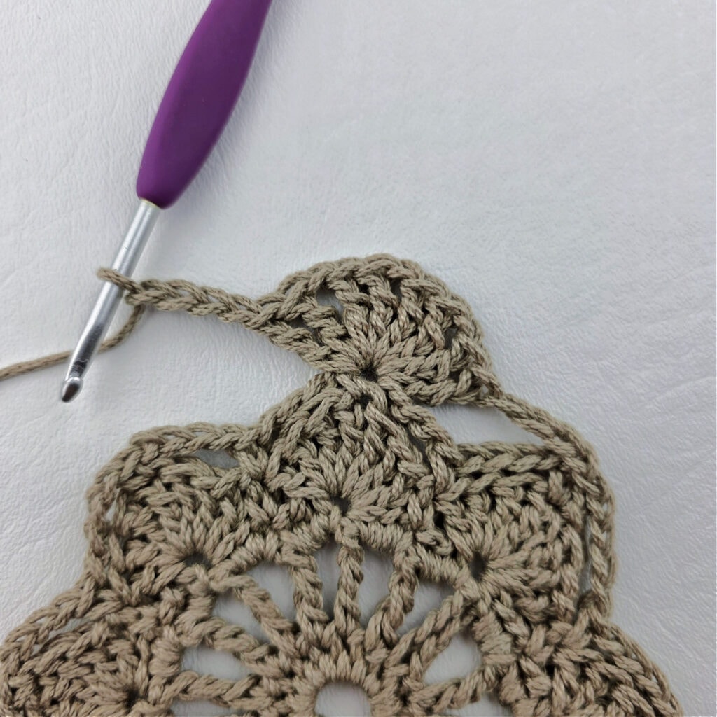 Round 6 of a crochet granny square motif.