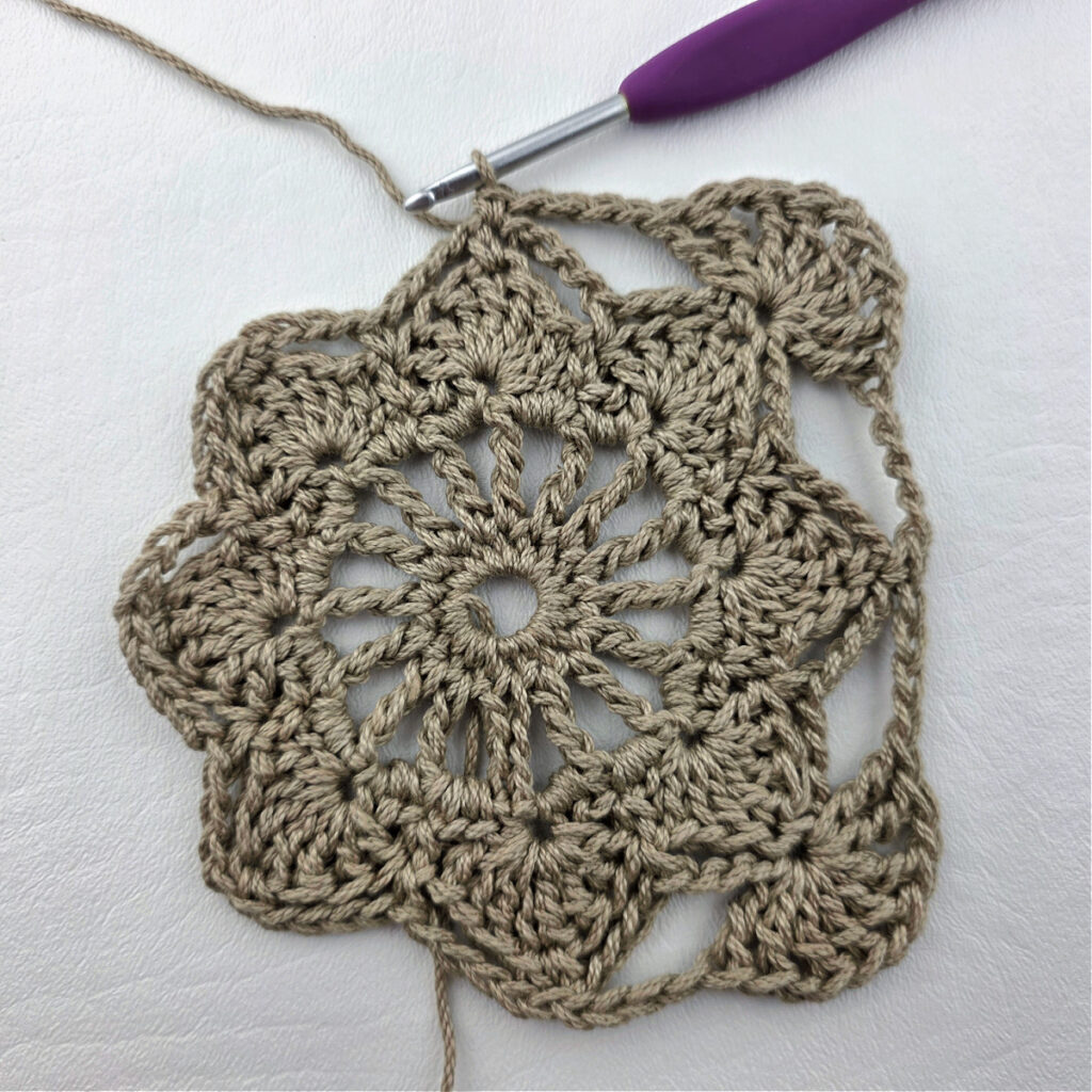 Round 6 of a crochet granny square motif.