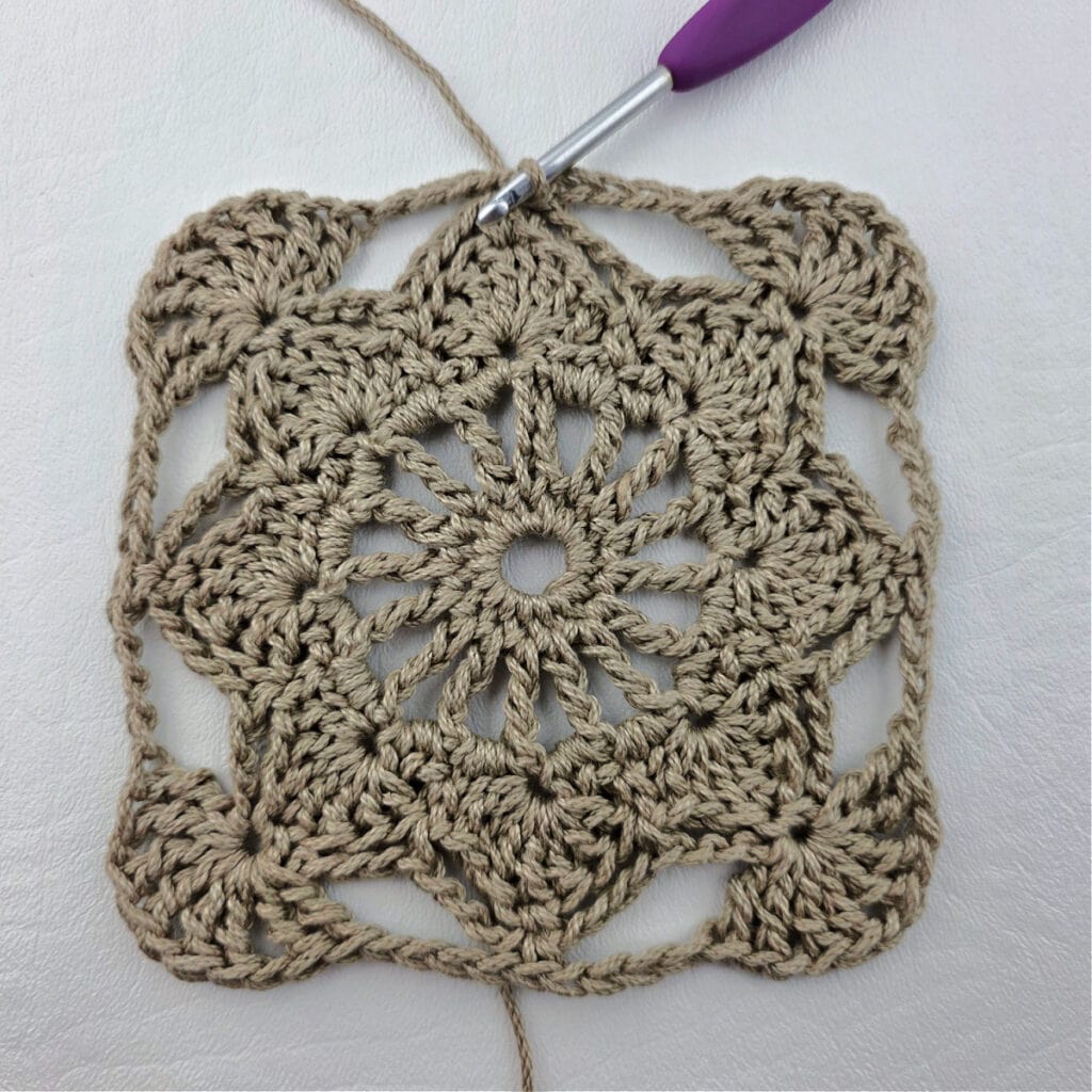 Round 6 of a crochet granny square motif.