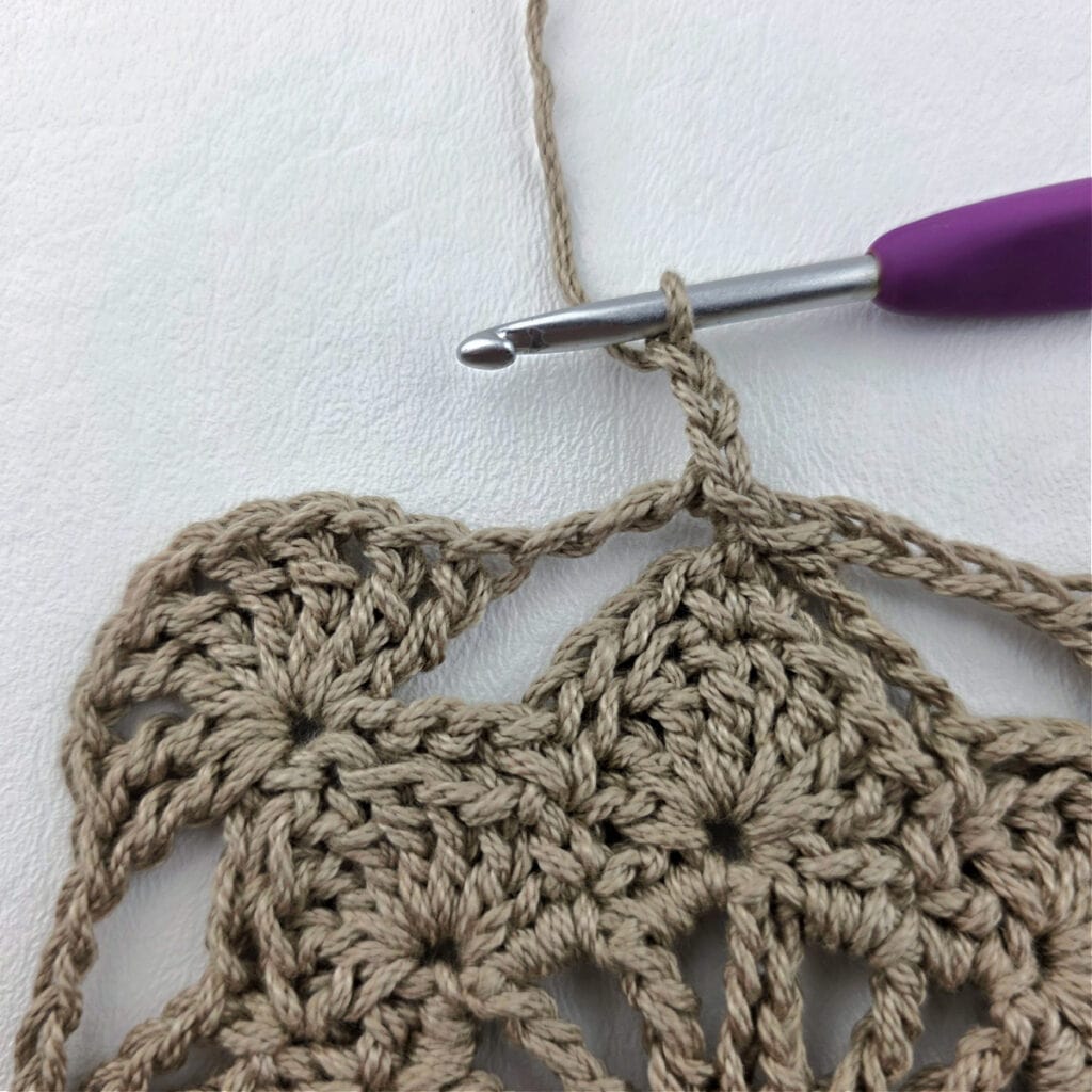 Round 7 of a crochet granny square motif.