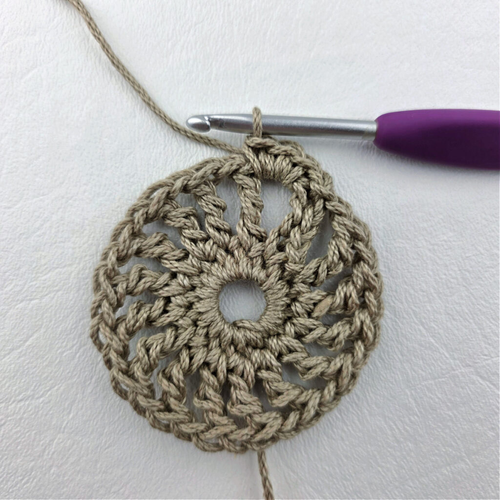 Round 3 of a crochet granny square motif.