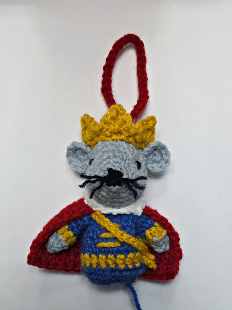 The mouse king crochet ormamet is ready to be attached to jingle bell.