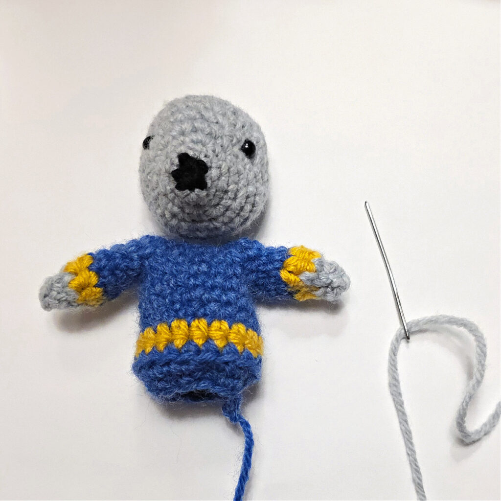 The mouse's body and head laid flat in front of you.