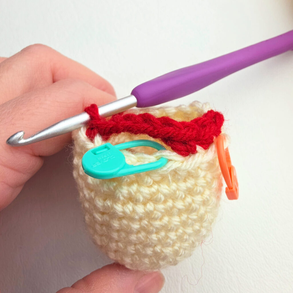 A close-up of one armhole opening on the nutcracker body.