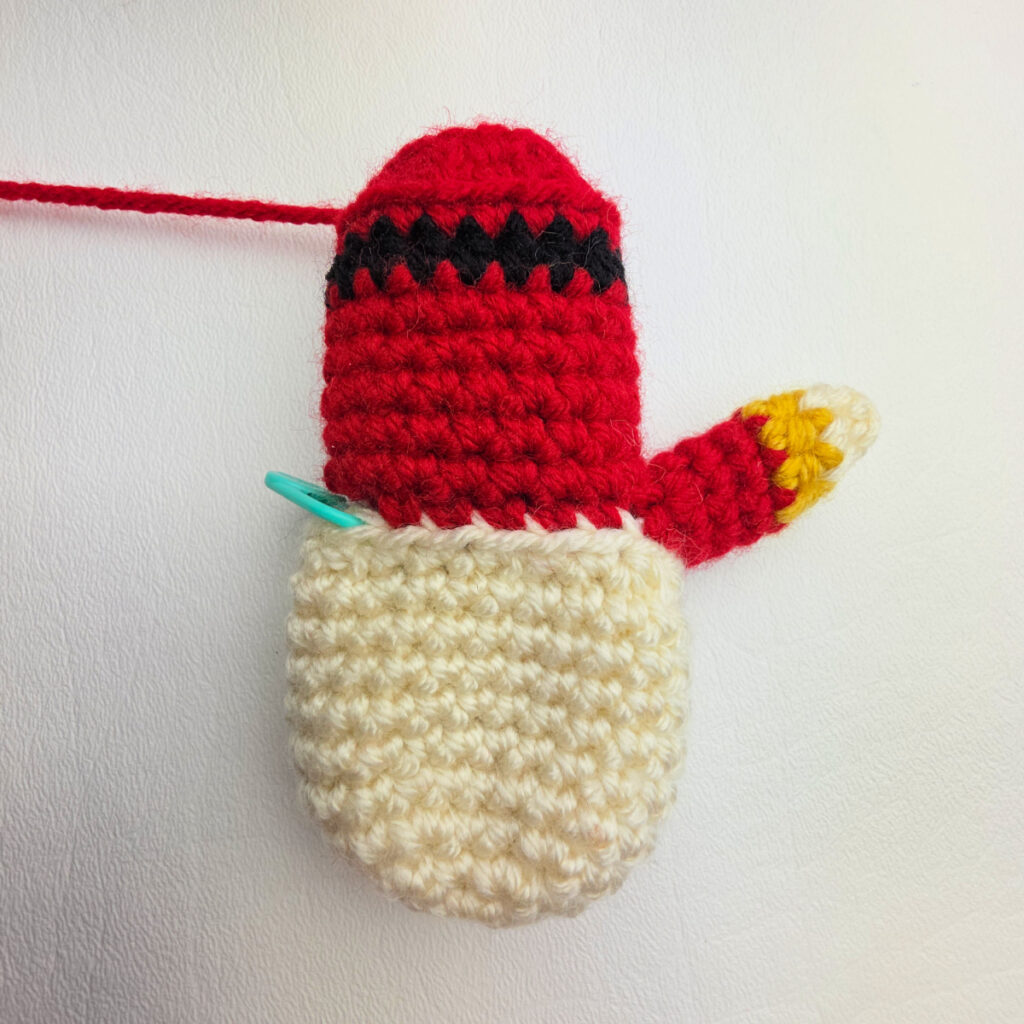 This photo shows the head and body of the nutcracker and one arm complete.