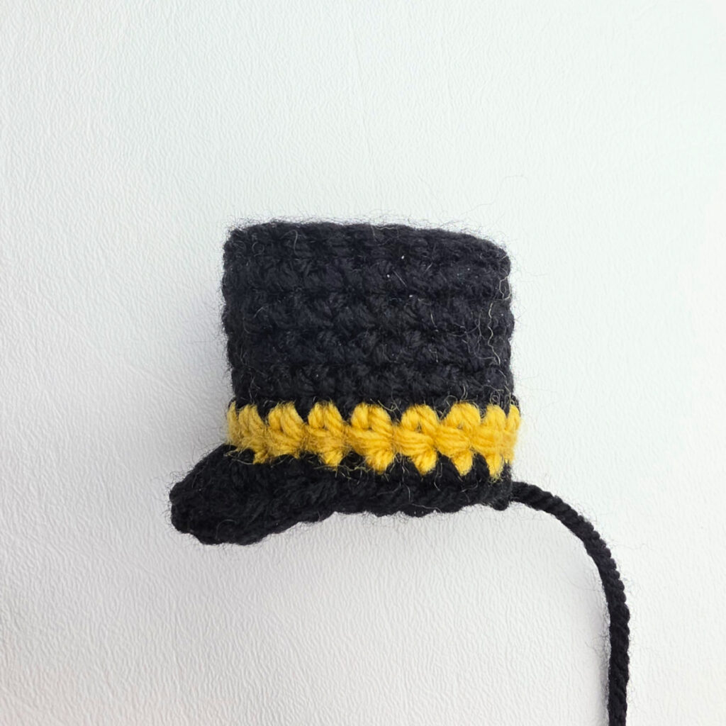 Side view of a small crochet Nutcracker's hat.