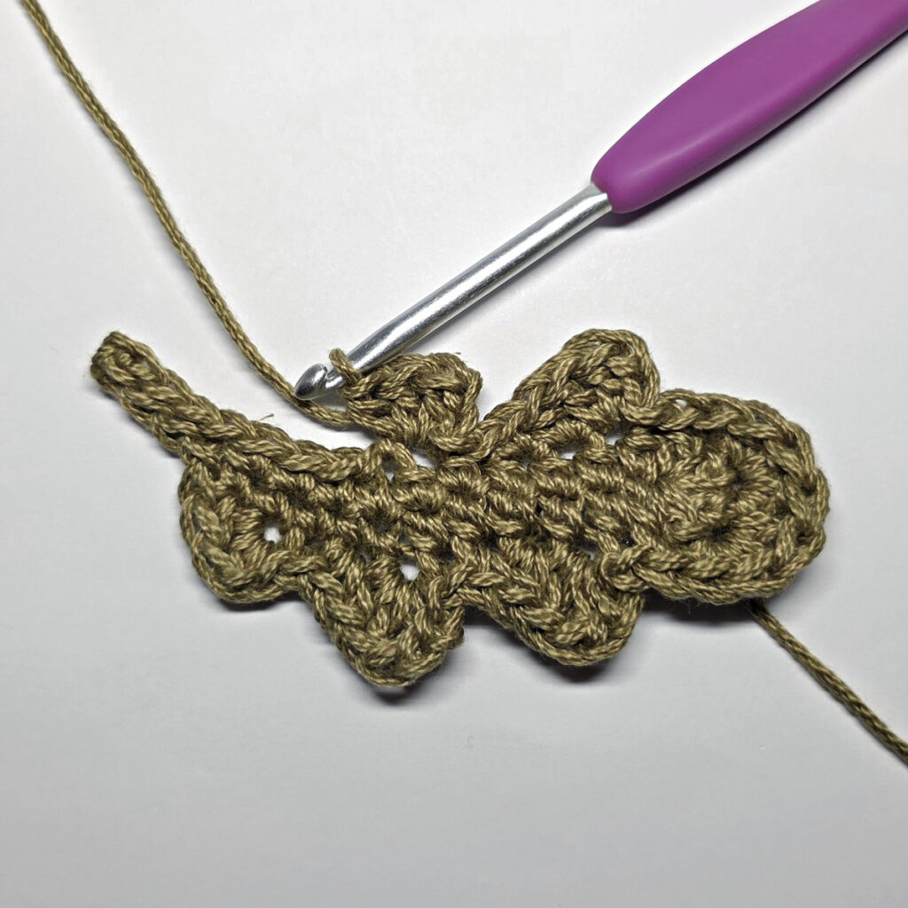Making a crochet oak leaf.