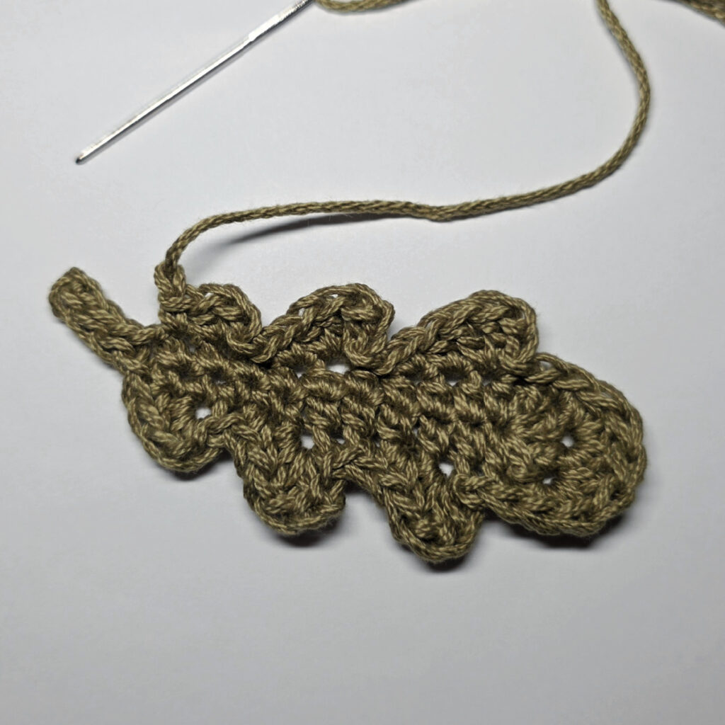 Making a crochet oak leaf.