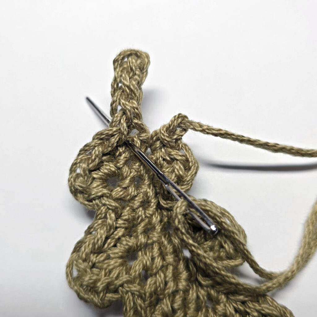 Making a crochet oak leaf.