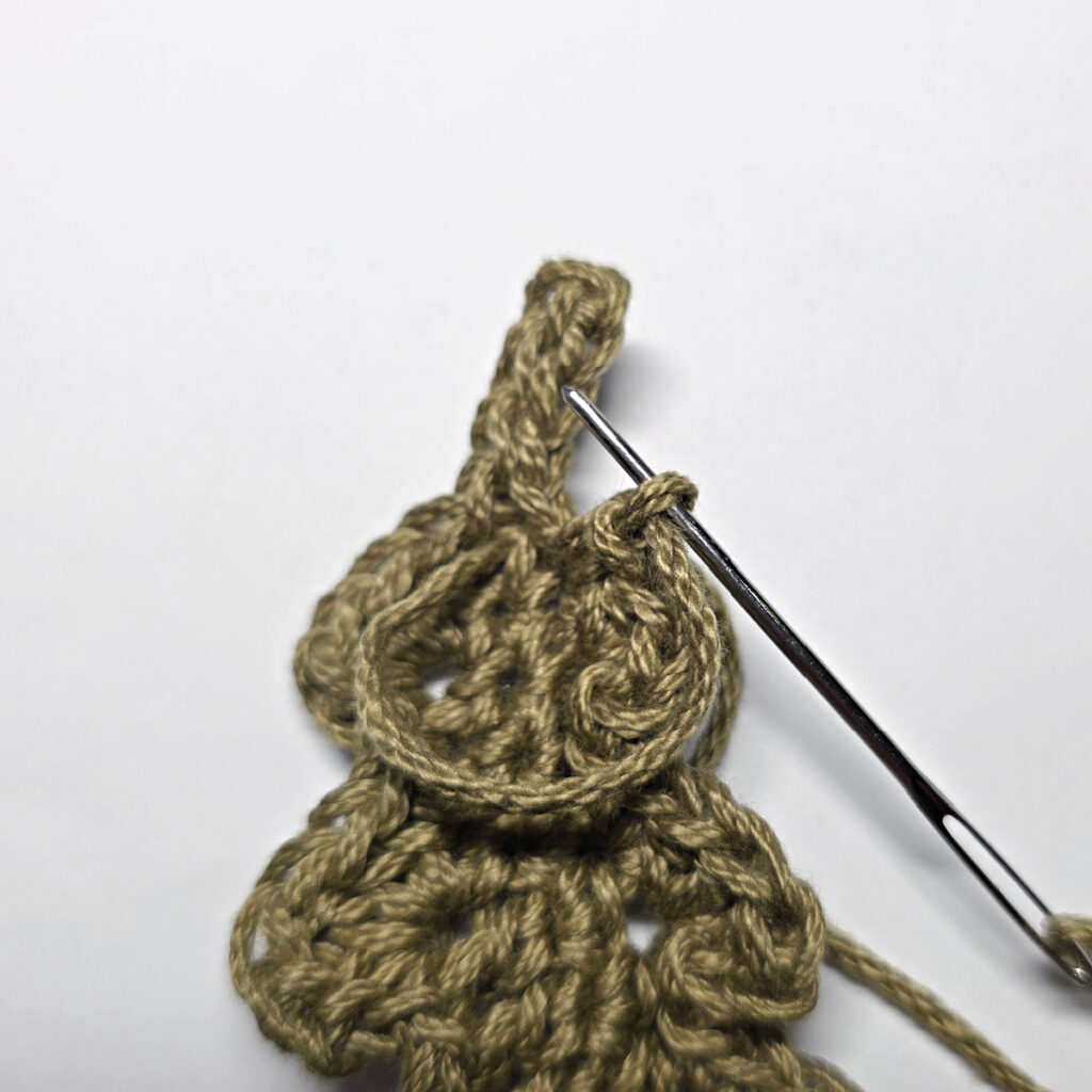Making a crochet oak leaf.
