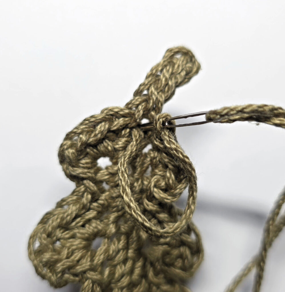 Making a crochet oak leaf.
