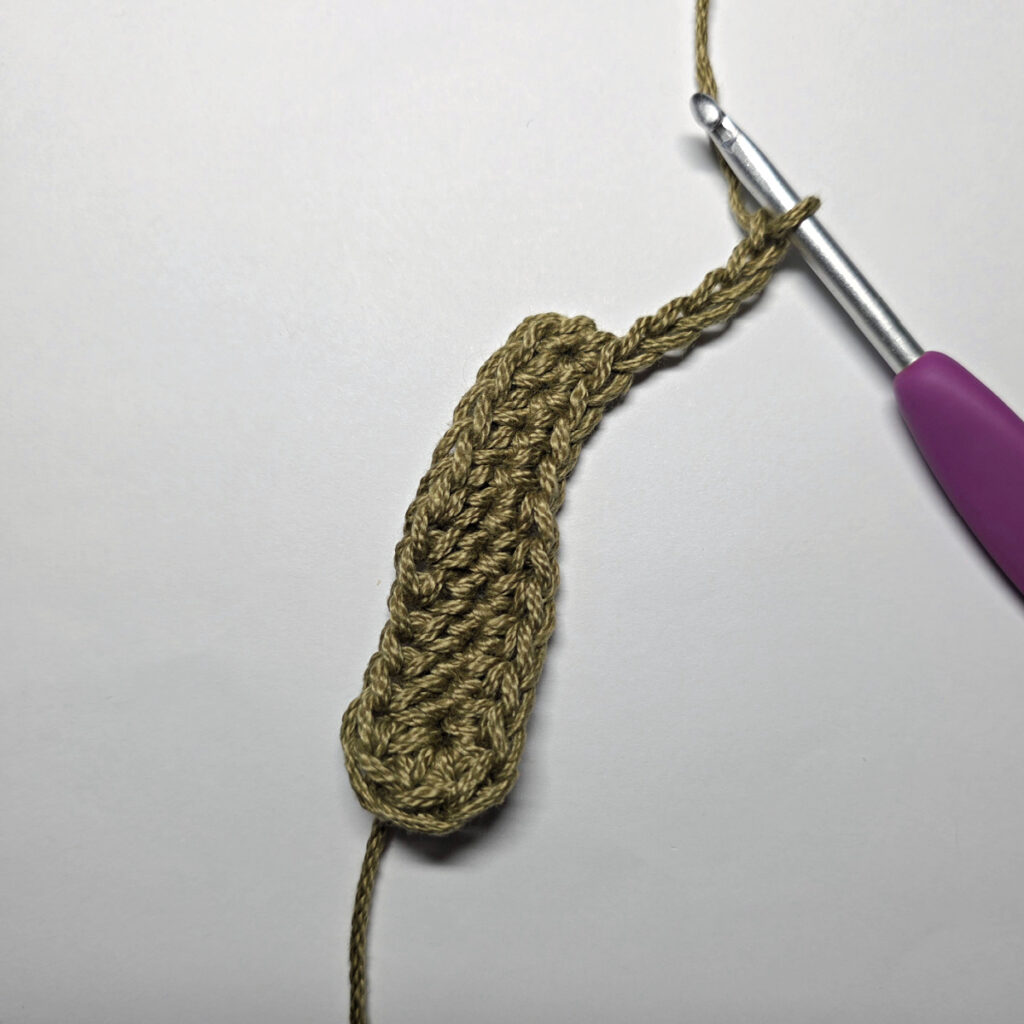Making a crochet oak leaf.
