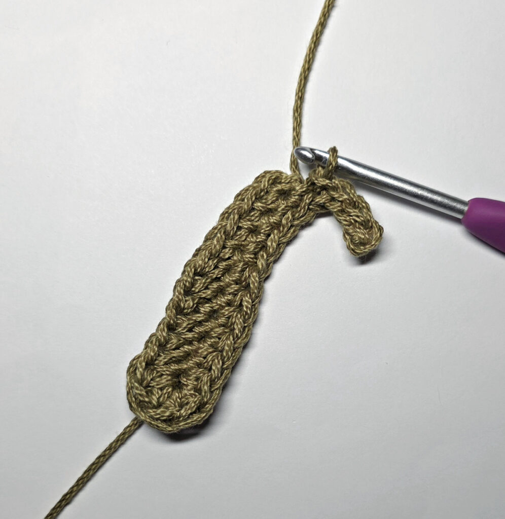 Making a crochet oak leaf.