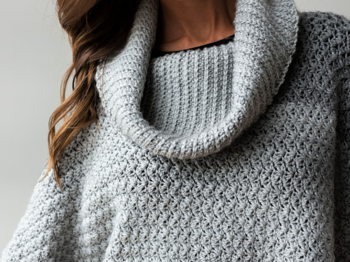 A closeup of a gray collared poncho.