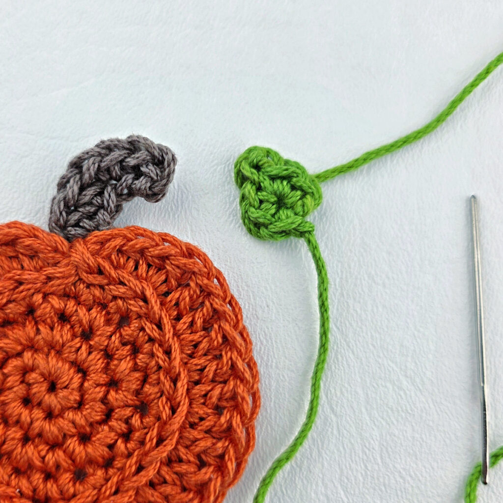 Making a crochet pumpkin leaf.