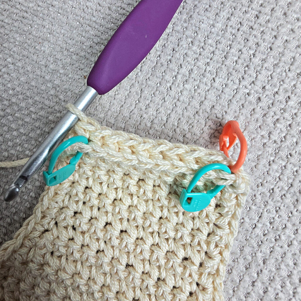 Making the body of a boho crochet crossbody bag.