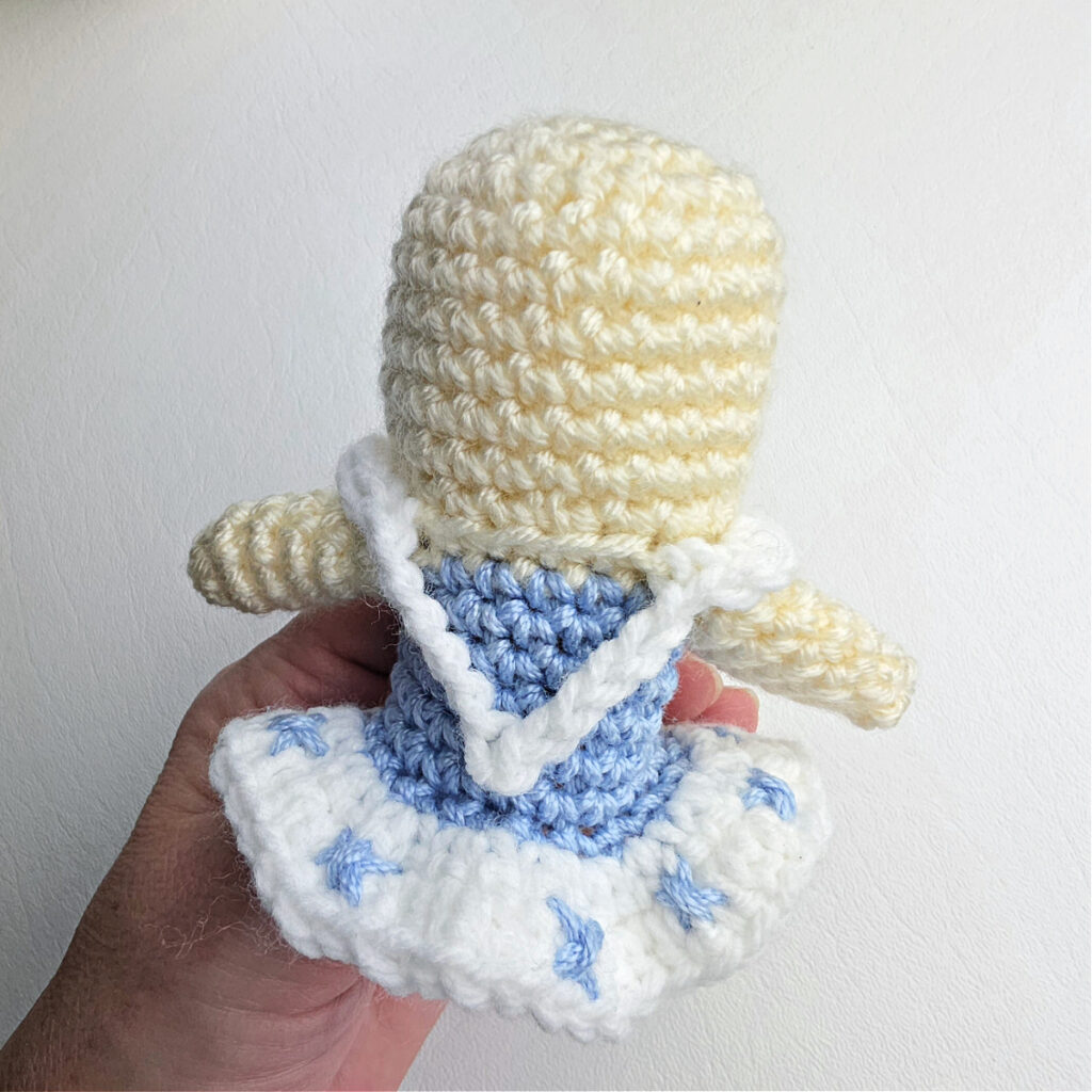 Little blue snowflakes stitched onto the white crochet tutu.