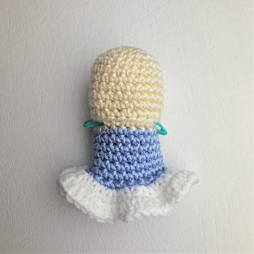 Crochet amigurumi head and body for ballerina ornament.