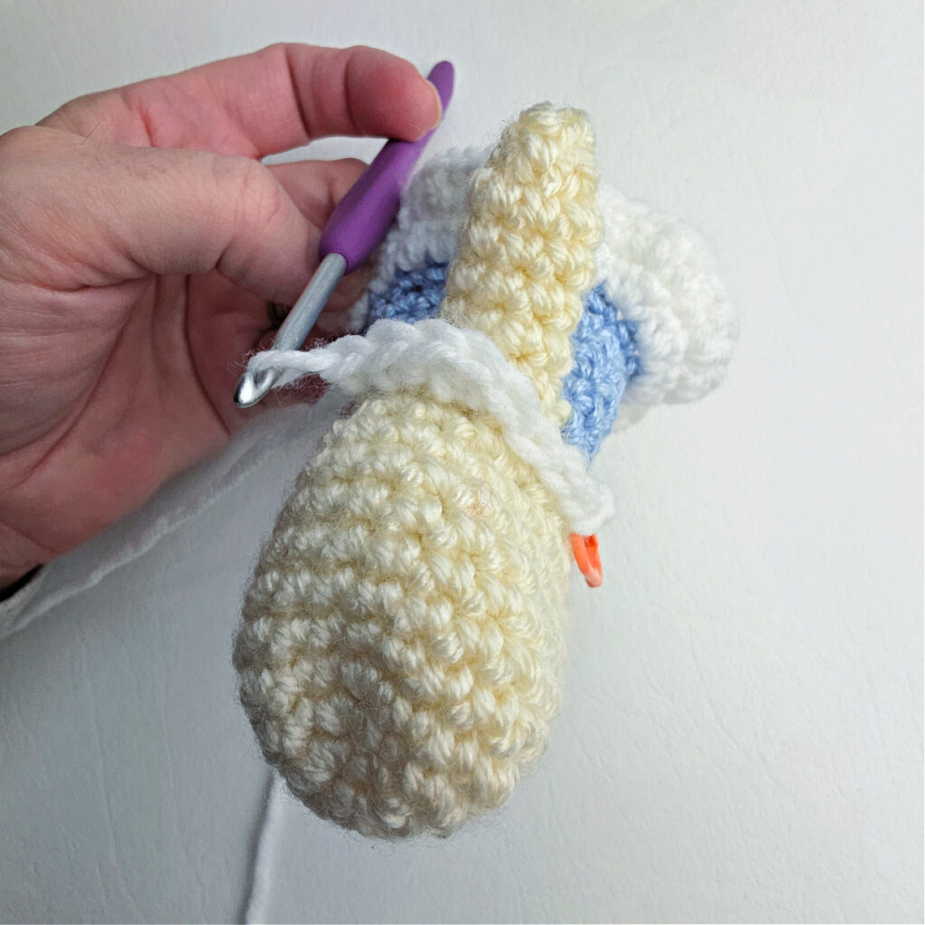 Close-up photo showing how to crochet the details on a ballerina's dress.