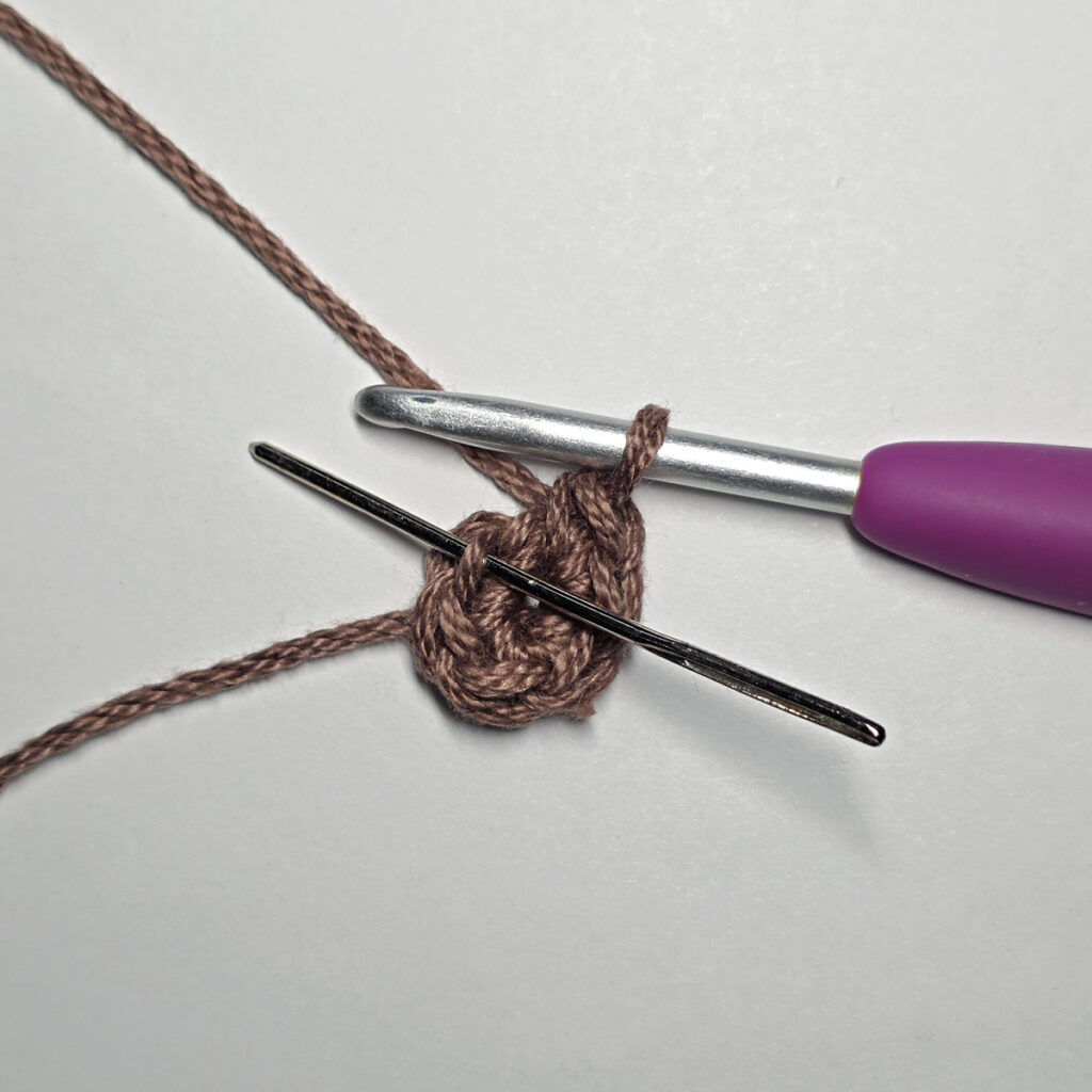 Making a crochet sunflower.