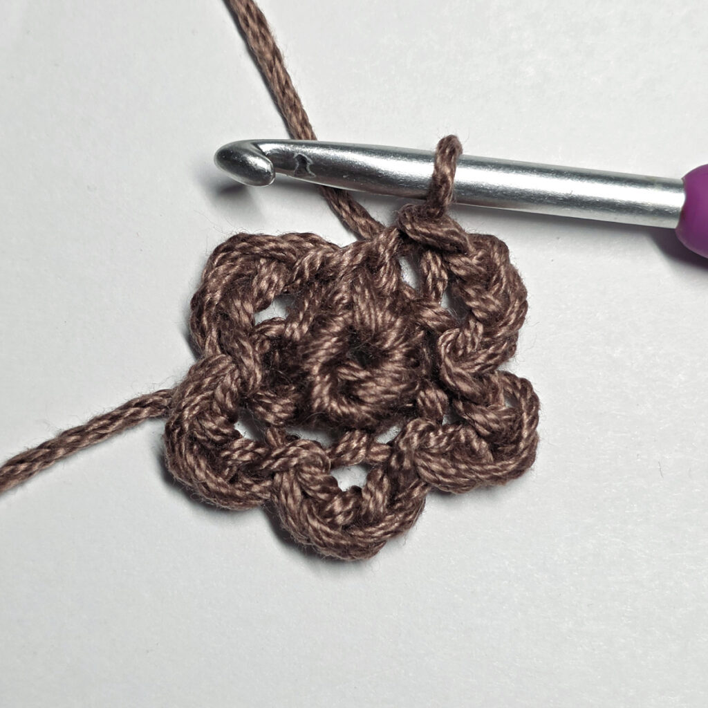 Making a crochet sunflower.