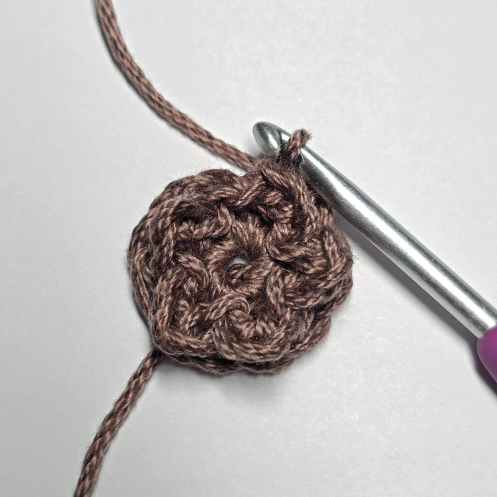Making a crochet sunflower.