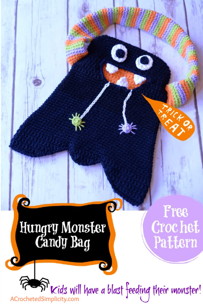 A black monster bag with a colorful handle and a wide toothy grin.