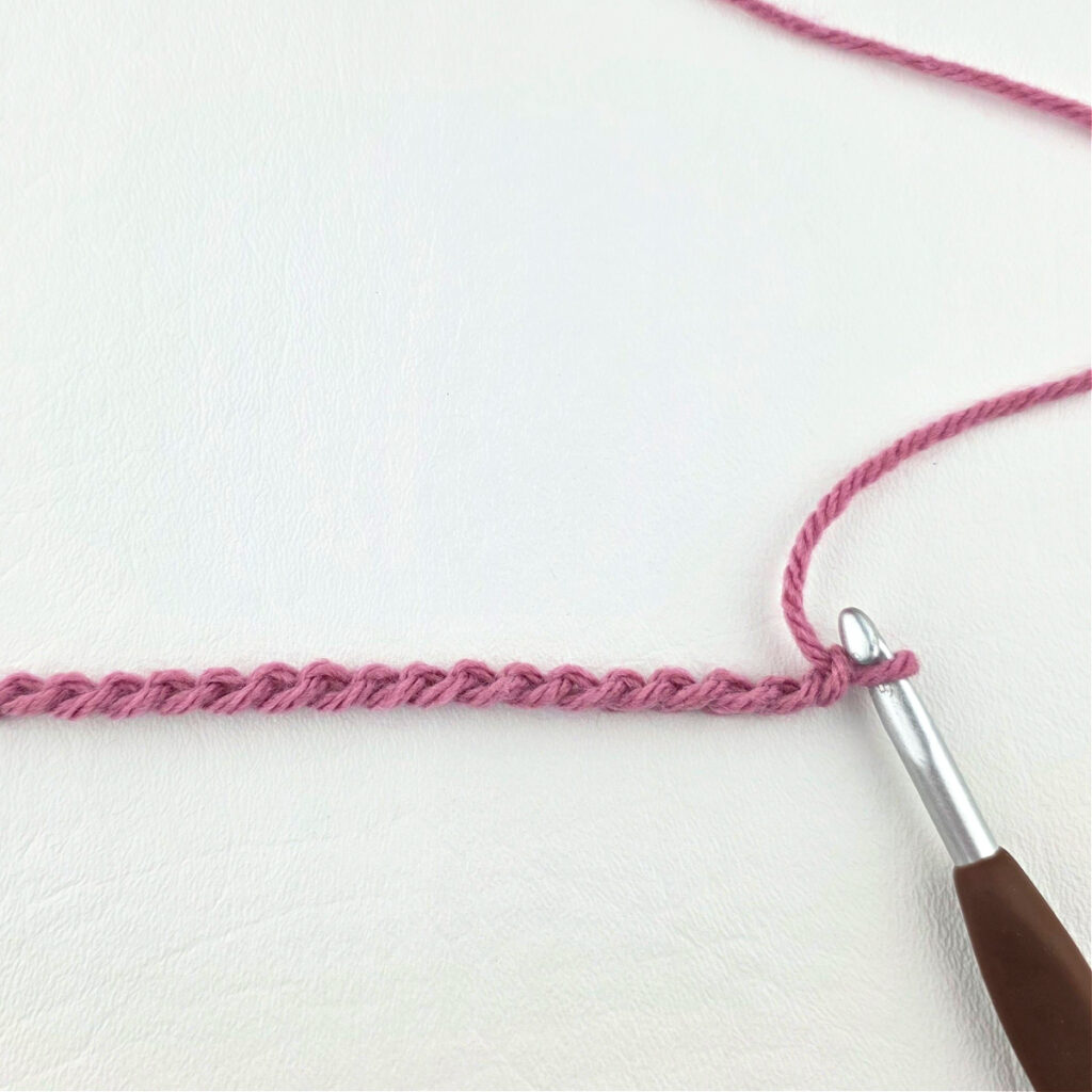 Creating a crochet wave stitch swatch.