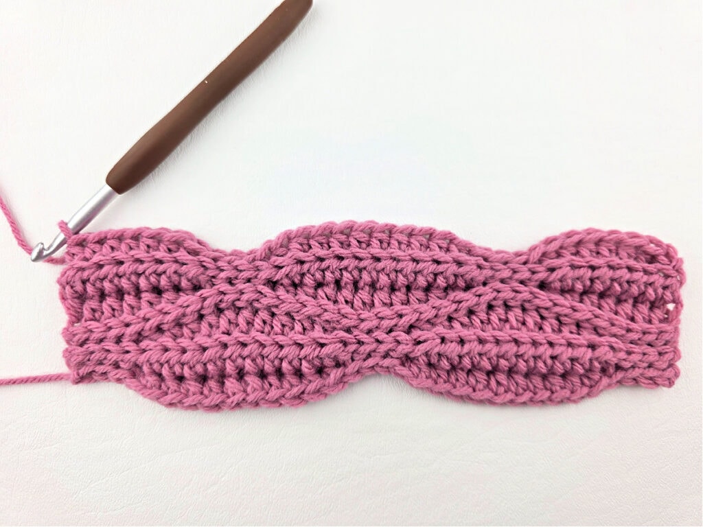 Creating a crochet wave stitch swatch.