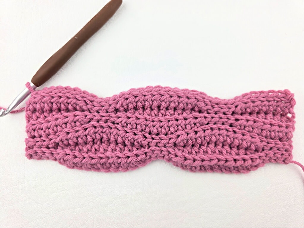 Creating a crochet wave stitch swatch.