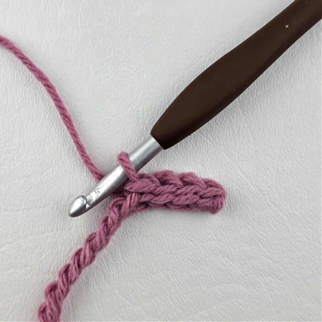 Creating a crochet wave stitch swatch.