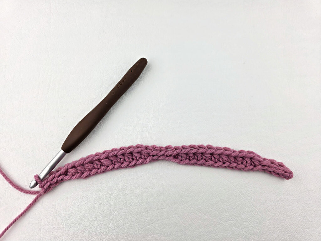 Creating a crochet wave stitch swatch.
