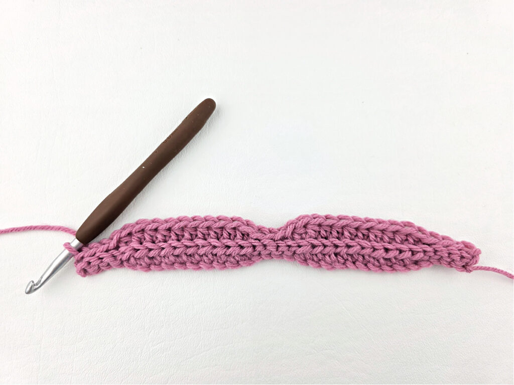 Creating a crochet wave stitch swatch.