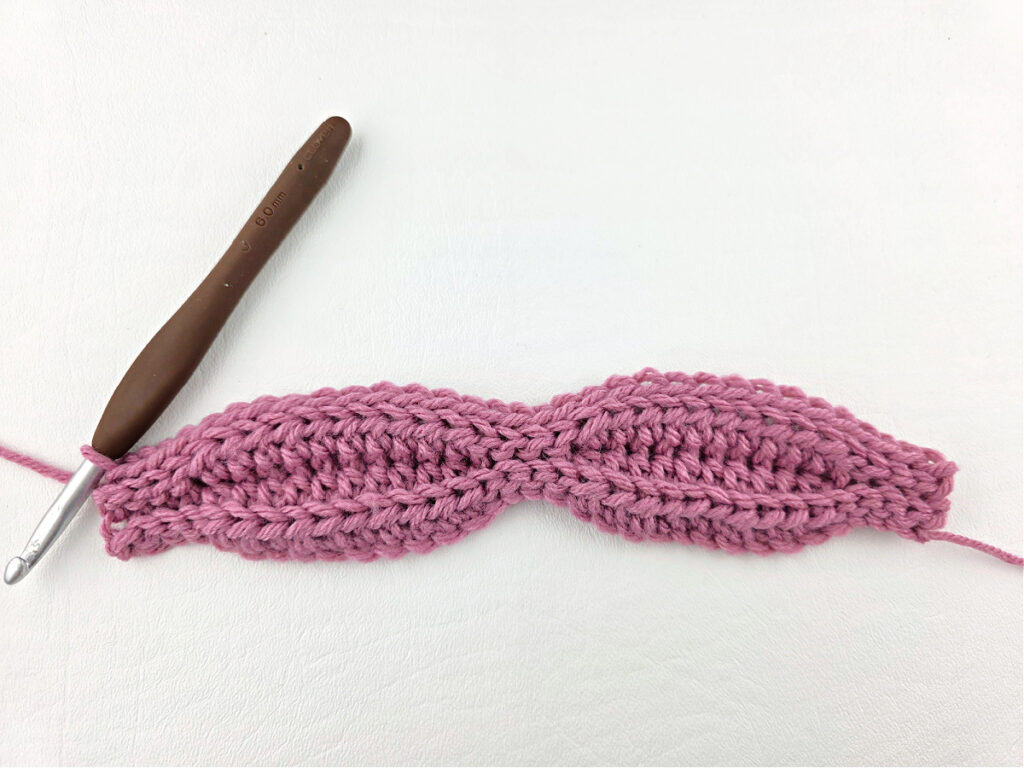 Creating a crochet wave stitch swatch.