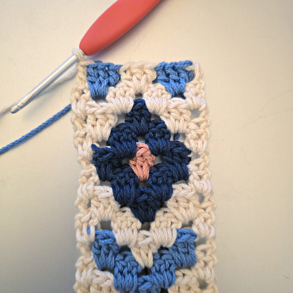 Making the colorful strap of a crossbody crochet bag.