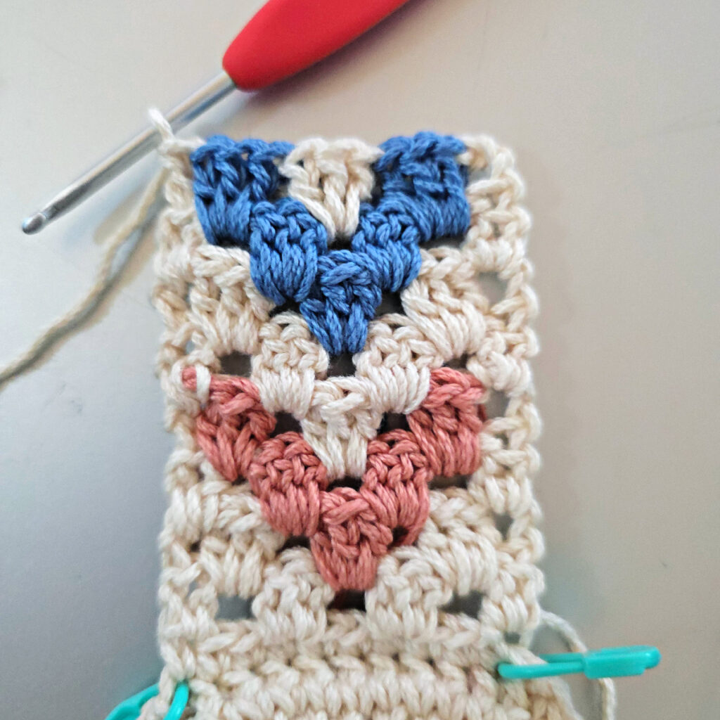 Making the colorful strap of a crossbody crochet bag.