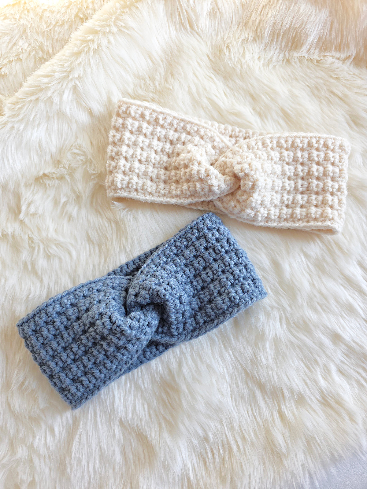 A gray crochet ear warmer and white crochet ear warmer against a white background.