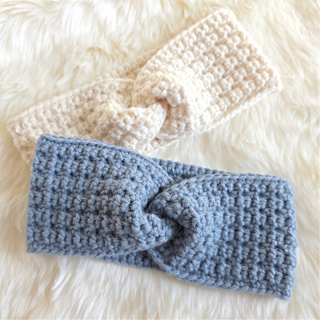 A gray crochet ear warmer and white crochet ear warmer against a white background.