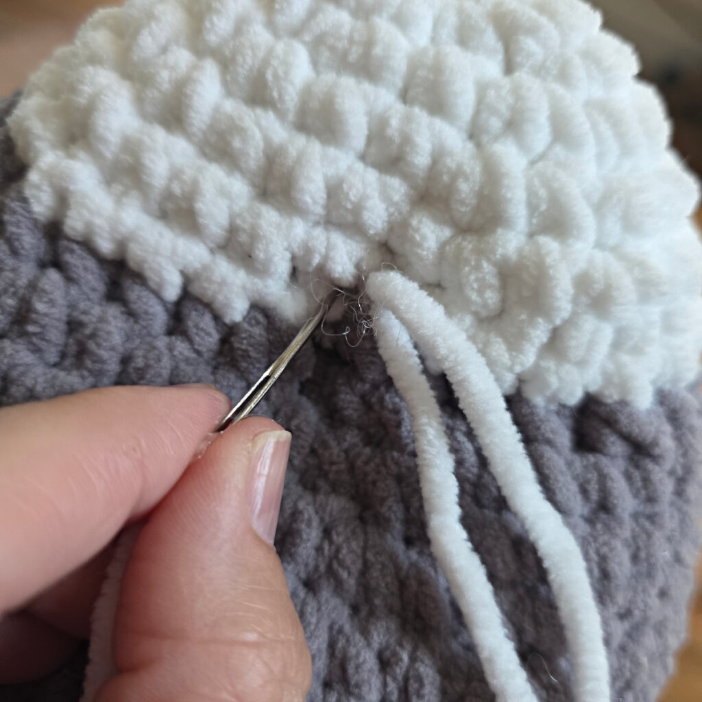 In process of assembling a crochet cat.