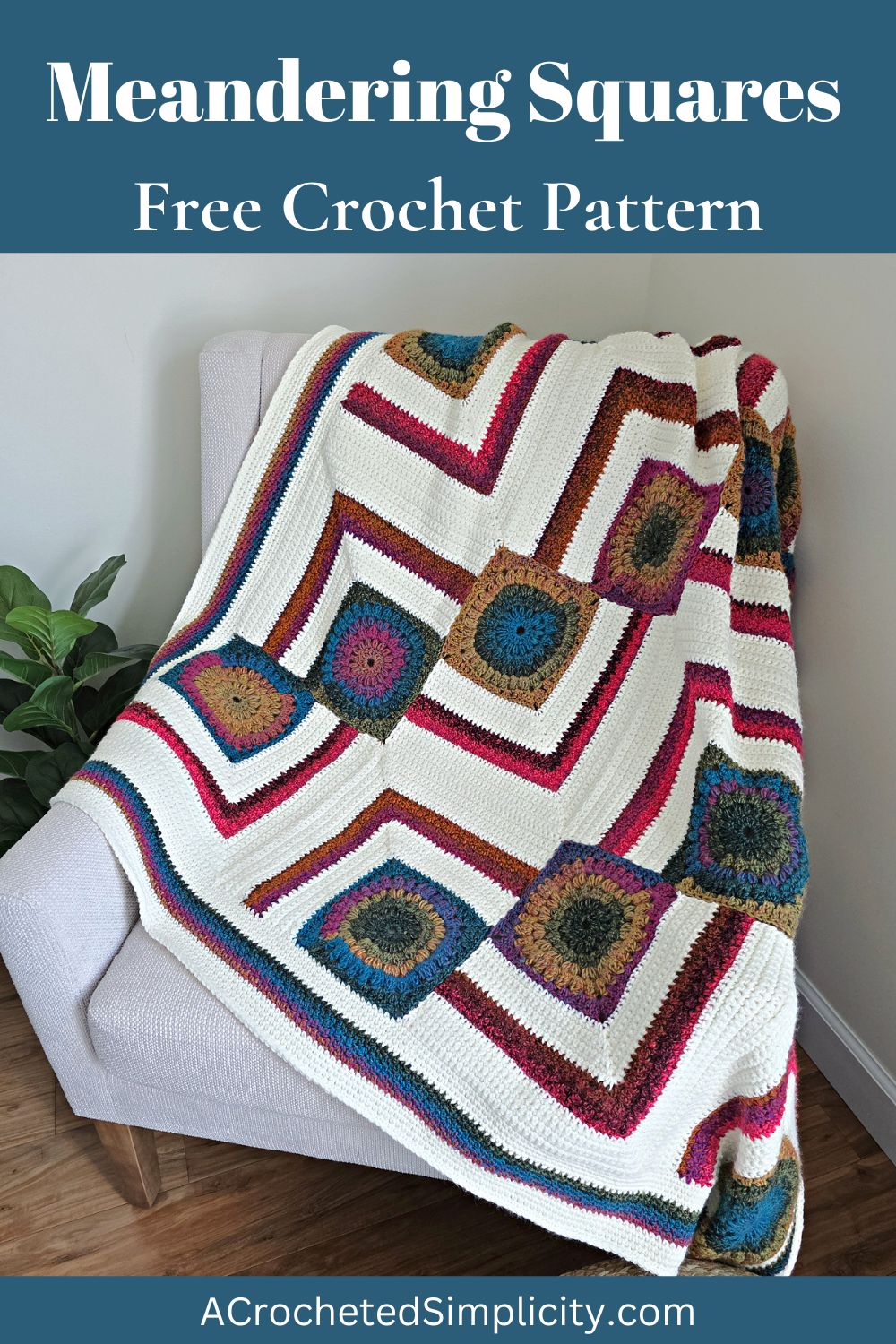 A colorful modern crochet blanket pattern free spread across a sofa with a plant next to it.