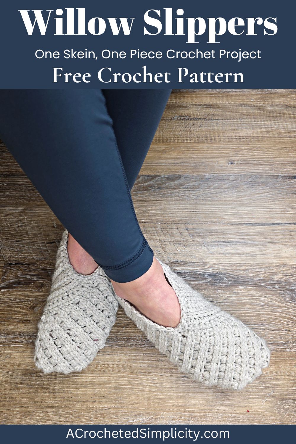 Model wearing grey crochet slippers on feet and blue leggings.