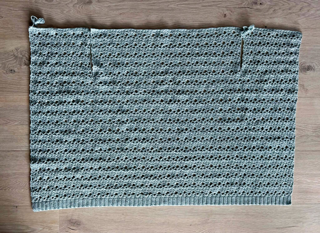 Making a blue summer crochet cardigan.