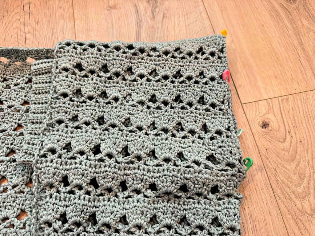 Making a blue summer crochet cardigan.